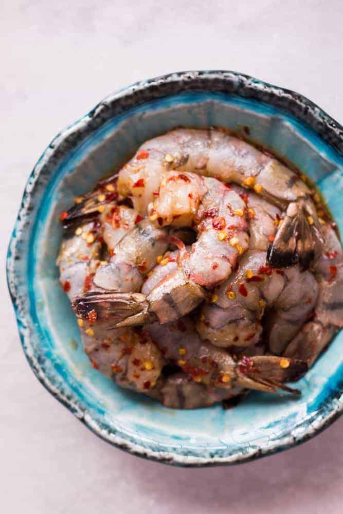Looking for meals that take under 15 minutes? This is it - 5 ingredient honey garlic chilli jumbo tiger prawns! All the asian flavours you love in this one easy recipe! You can use shrimp, prawns or scampi and add whatever veggie you like - broccoli, bok choy, beans or even spinach! Soy free, gluten free, probably Whole30, Paleo and nut free!