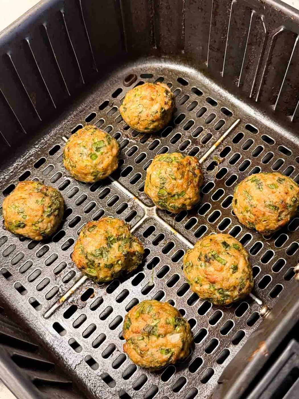 chicken meatballs freshly cooked still in the air fryer