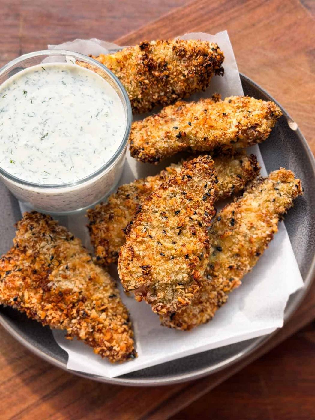Air Fryer Chicken Tenders served in a grey plate with dill yogurt dip