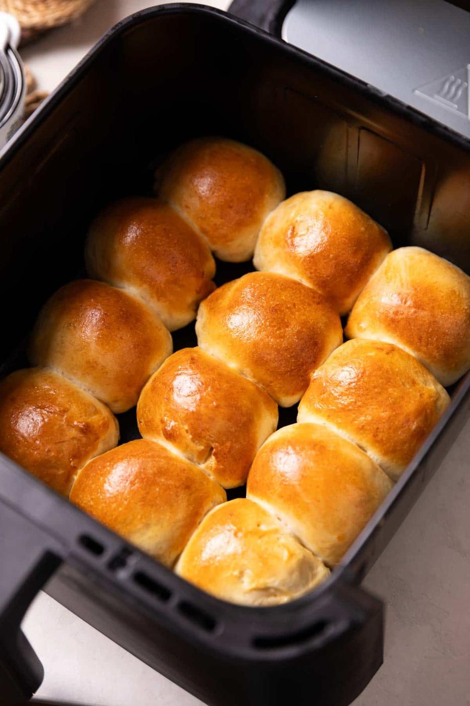 freshly baked dinner rolls in an air fryer