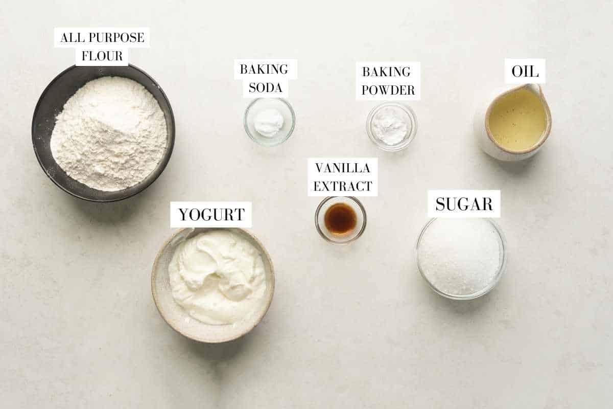 Picture of all the ingredients required for the air fryer vanilla cake with text to identify them