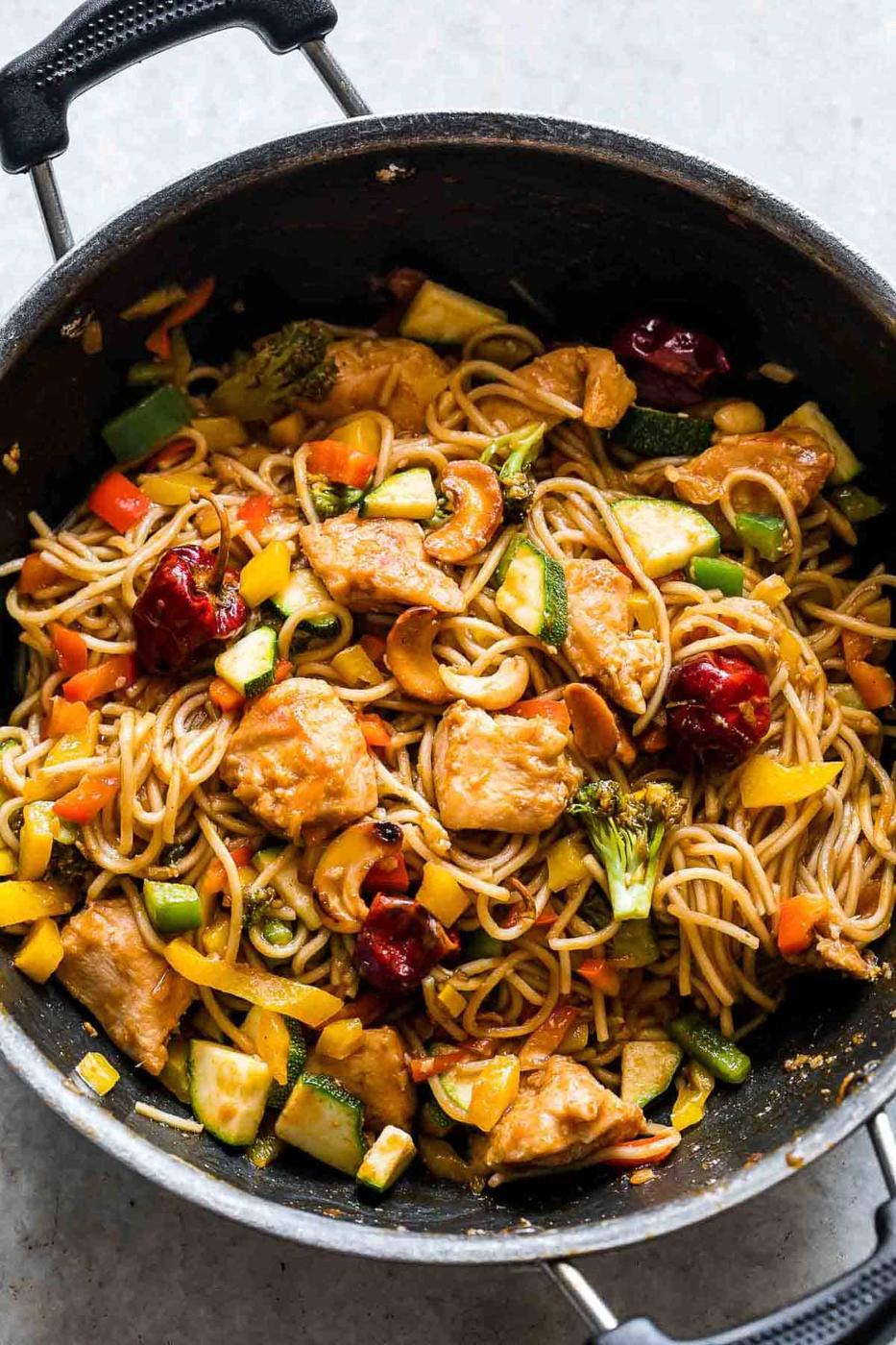 Chinese Cashew Chicken Noodles Stir-Fry in a pan.