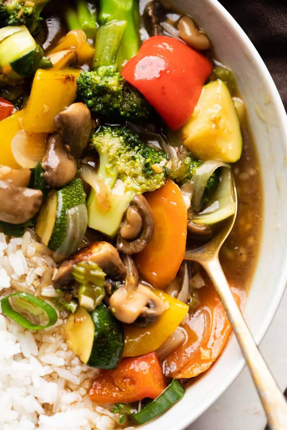 Closeup of Asian Veg Stir Fry served in a bowl over white rice
