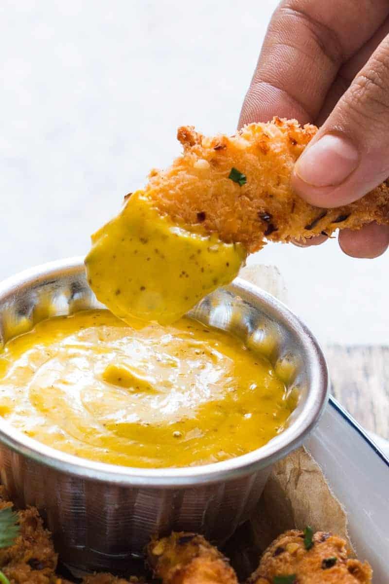 Easy recipe for super crunchy baked coconut crusted chicken tenders which are going to be a favourite at every party with kids and adults alike! Gluten free too.
