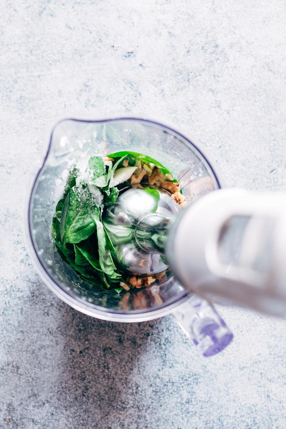 Basil Walnut Pesto is a super easy, homemade vegan pesto recipe that is perfect with pasta dishes, salads, on chicken and salmon as a sauce or even as a dip! The walnuts give it a creamy base which helps avoid the parmesan altogether, and are a great substitute to pine nuts.