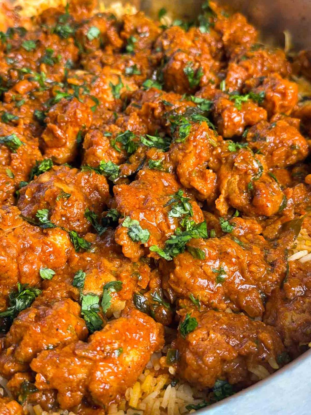 close up of boneless chicken biryani to showcase it's texture