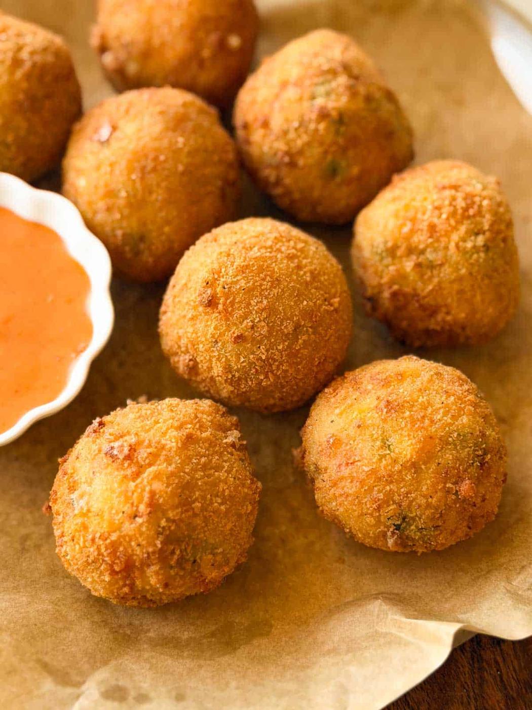 a close up image of cheese balls to showcase their crispy texture