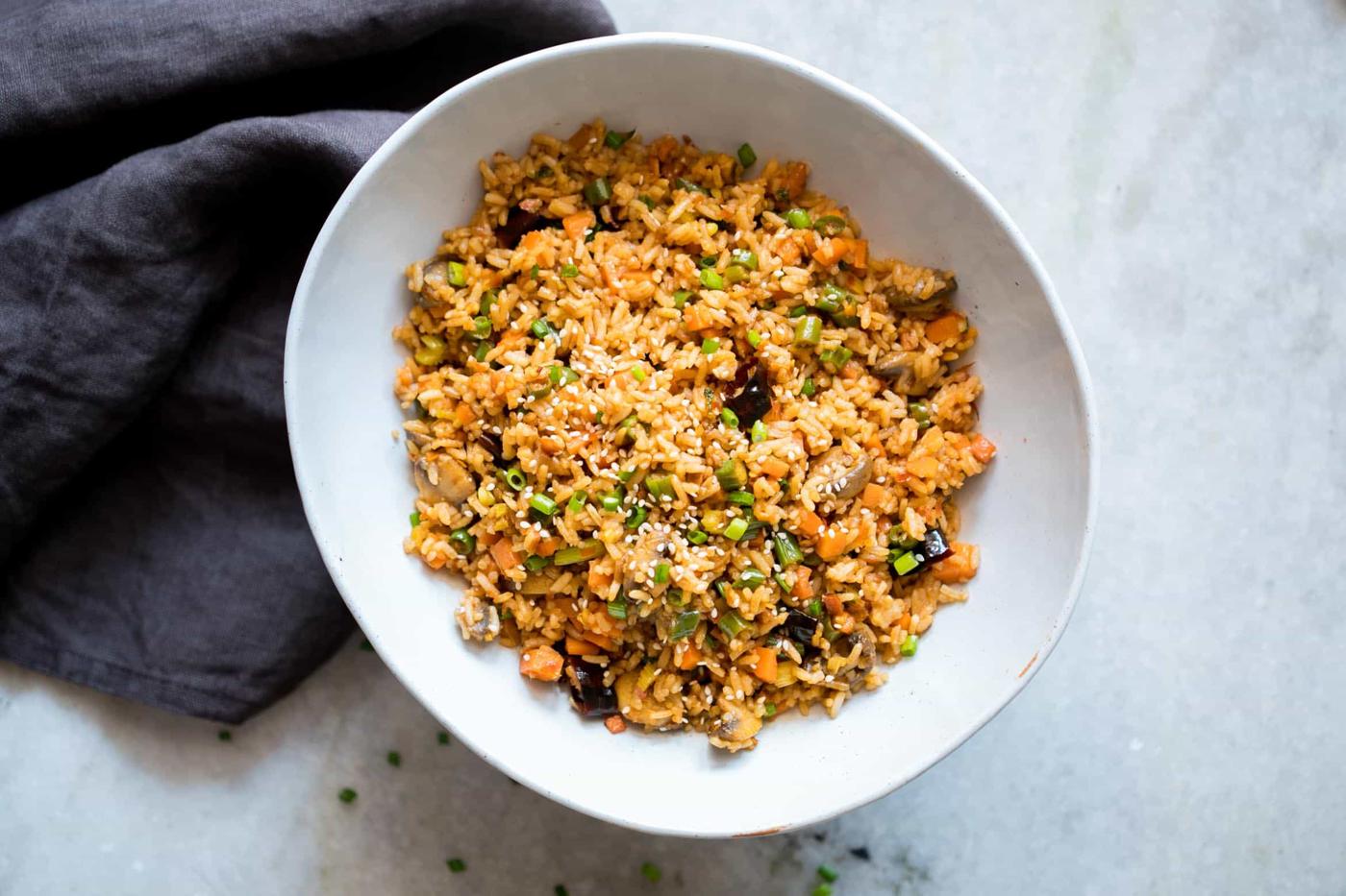 This is the best chinese schezwan fried rice you'll make - loaded with vegetables, spicy and super easy! Made with sichuan sauce, it's the best way to use leftover rice.