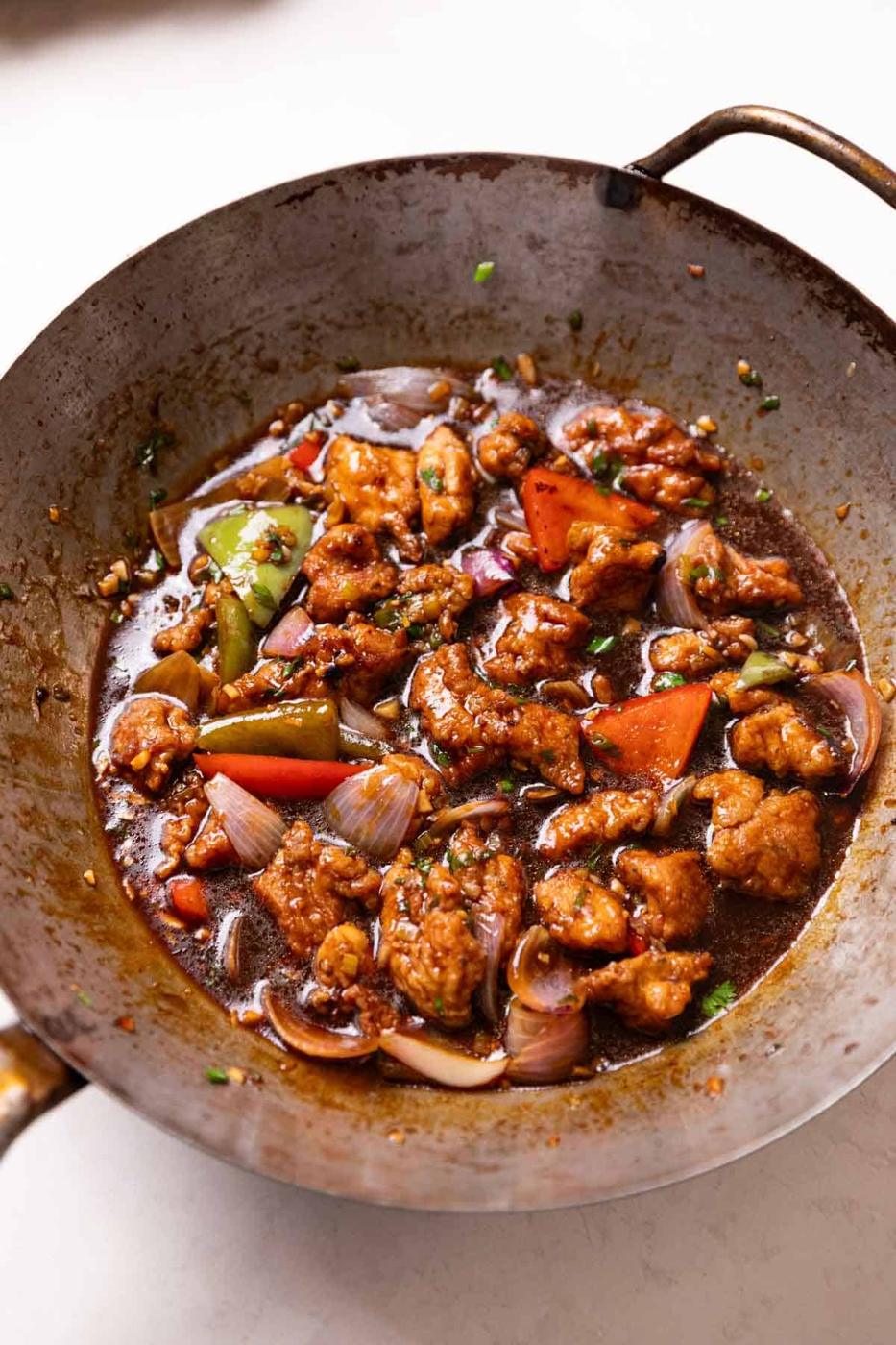 freshly cooked chicken manchurian in a wok, ready to be served