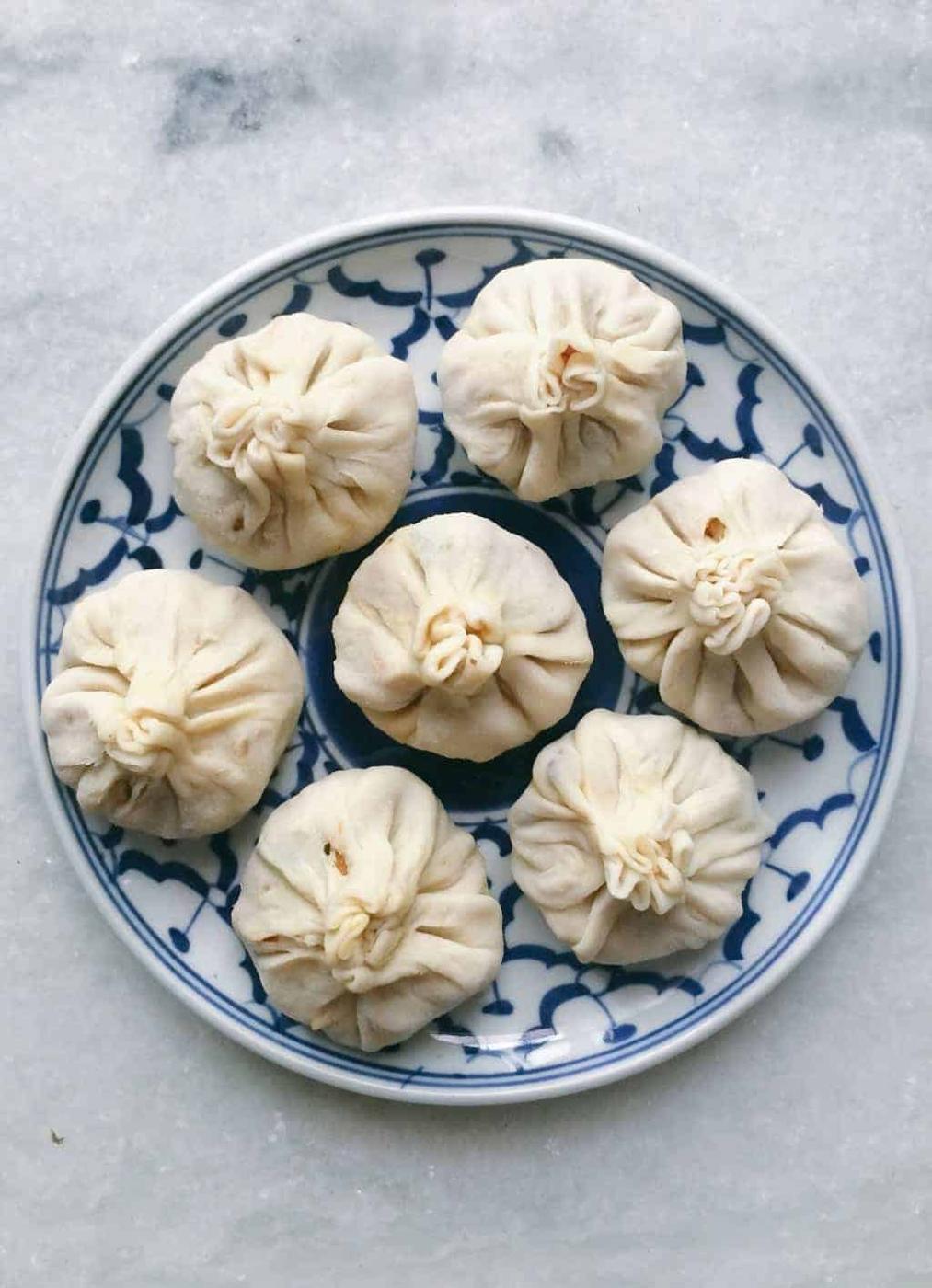 Love samosas? These vegetarian chinese potli samosa wontons are going to blow you over! I used a lo mein noodle filling but you can just as easily use shrimp, cream cheese, even chocolate to make these wontons at home. Also includes recipe for homemade samosa wrappers!