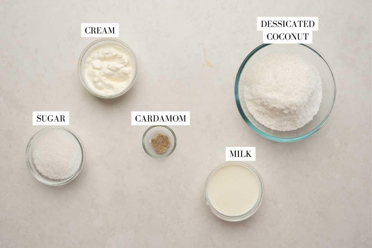 Picture of all the ingredients for coconut barfi with text to identify them