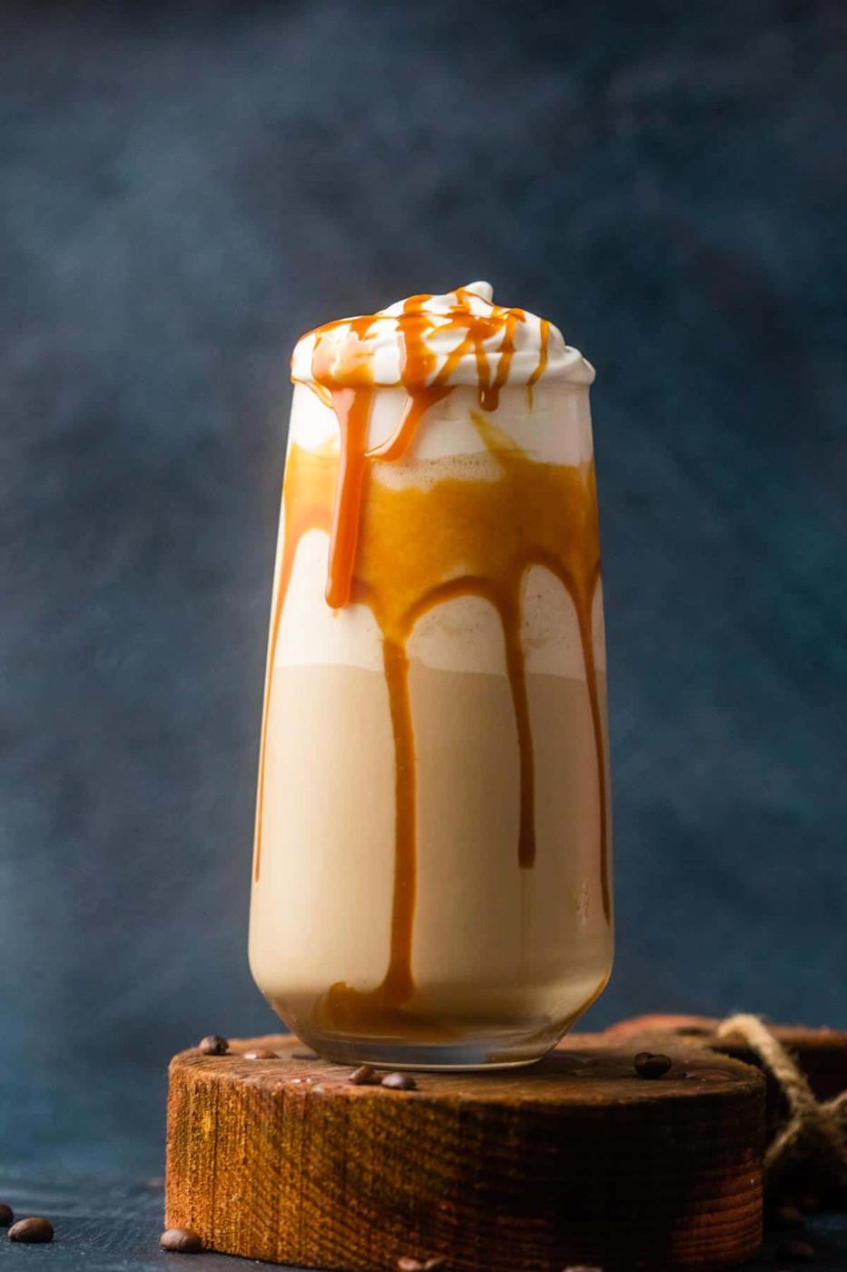 Caramel cold coffee served in a tall glass