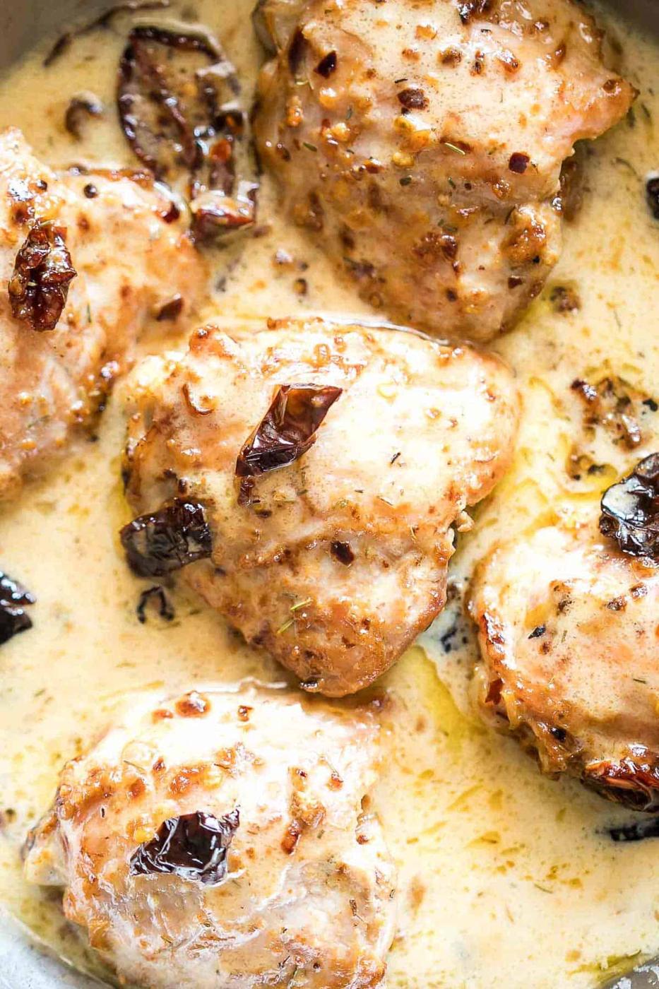 Creamy Sun-dried Tomato Chicken in a pan.