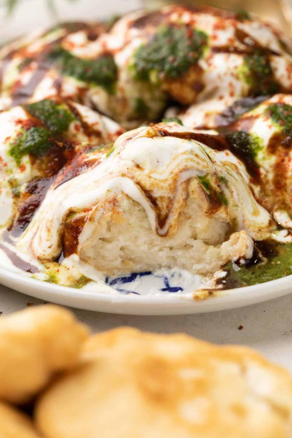 close up of a cut piece of dahi vada