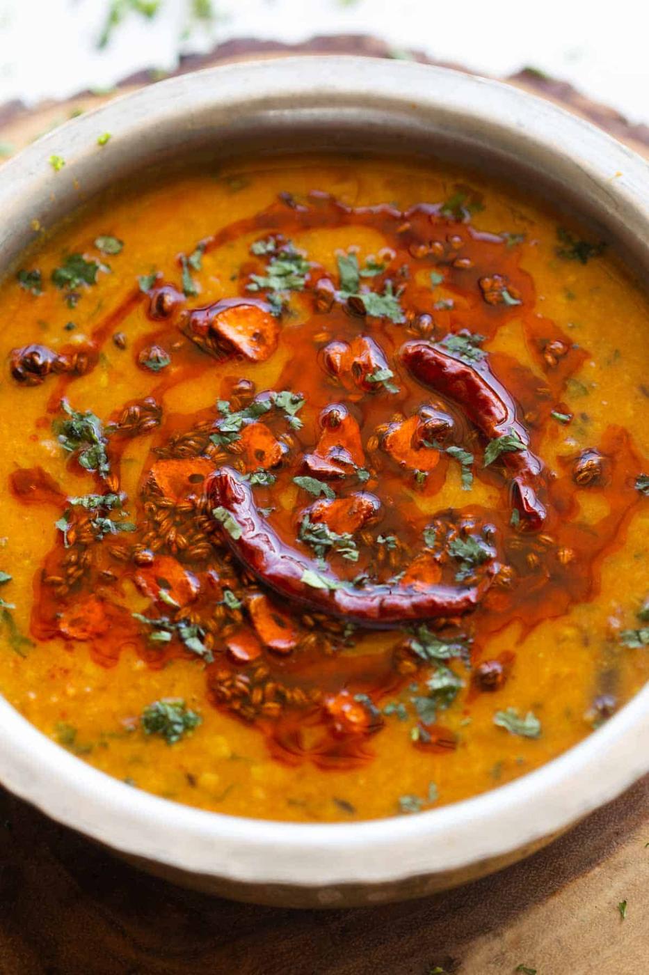 a close up image of dal tadka to show it's creamy texture and tadka