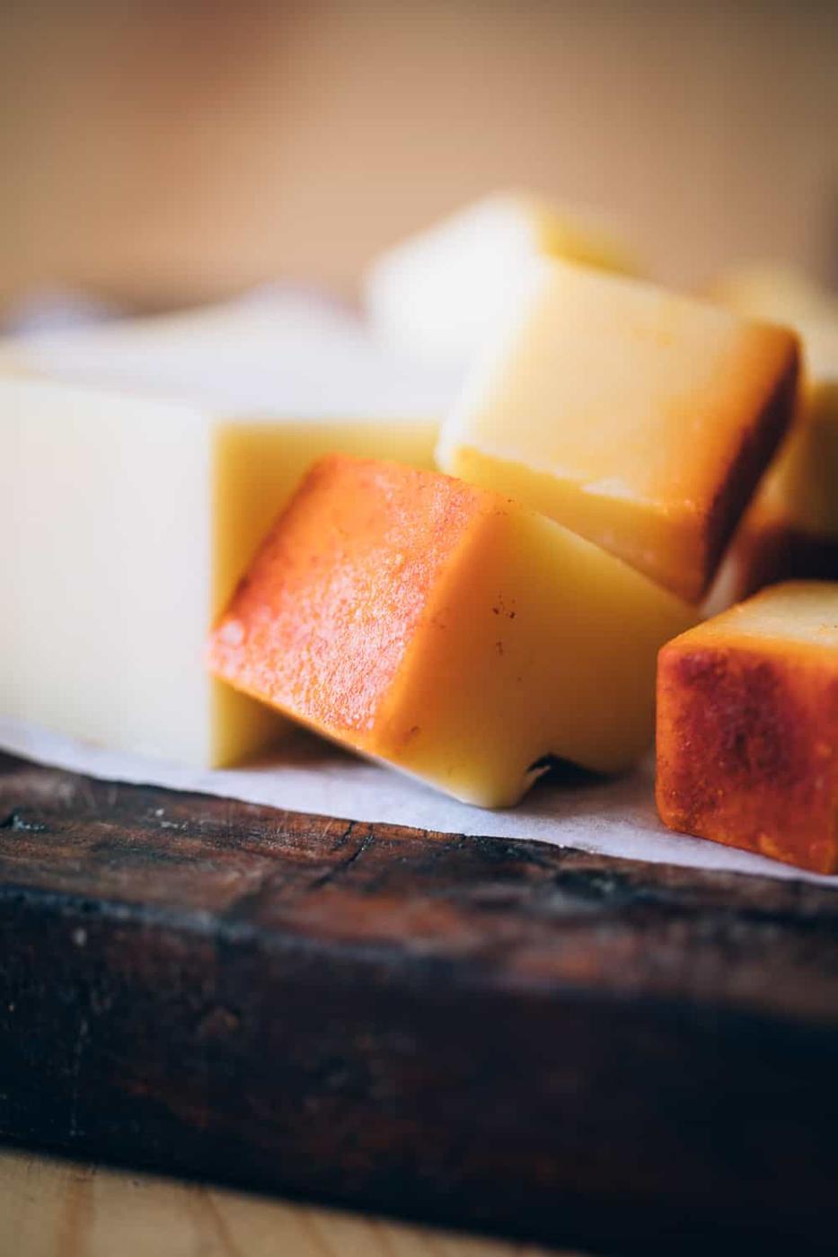 Picture of gruyere, emmental, cheddar cut up into chunks for Easy cheese fondue recipe with white wine