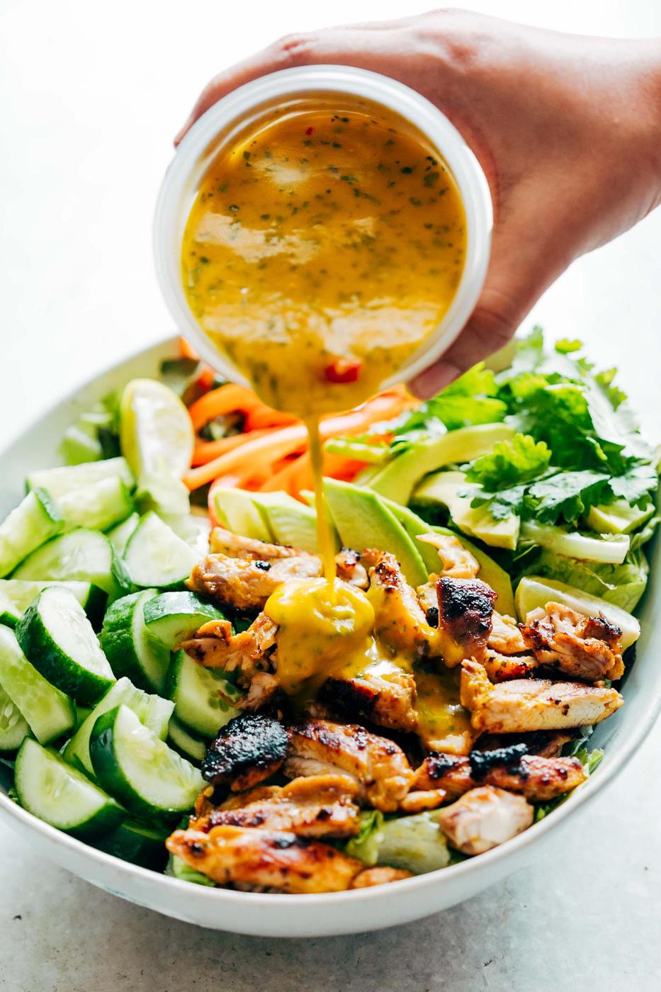Grilled Chicken Mango Salad with Mango Cilantro Dressing is loaded with cucumbers, peppers, avocado and has a crazy good dressing that doubles up as a marinade! Best summer salad ever!