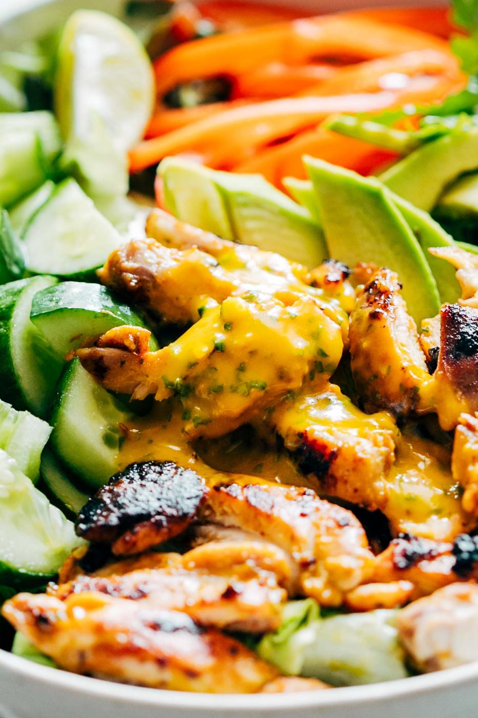 Grilled Chicken Mango Salad with Mango Cilantro Dressing is loaded with cucumbers, peppers, avocado and has a crazy good dressing that doubles up as a marinade! Best summer salad ever!