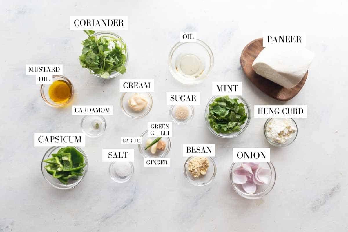 Picture of all the ingredients for Hariyali Paneer Tikka with text to identify them