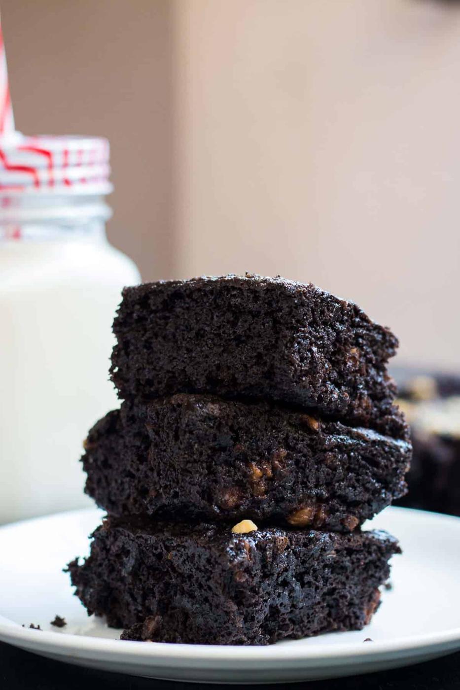 Eggless brownies served on a white plate.