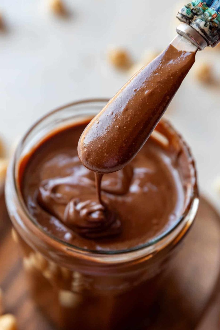 Homemade Nutella chocolate spread in a jar with spoon