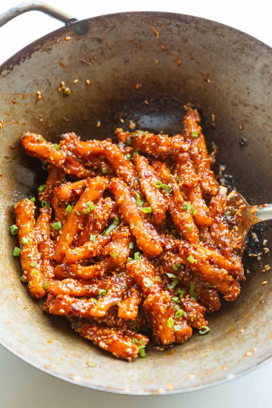 crispy honey chilli potatoes in a wok straight from the stove