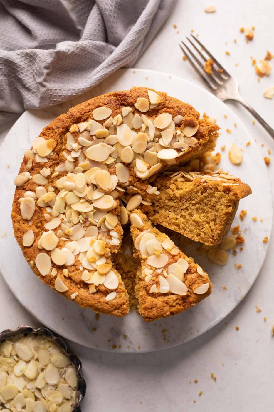 Mawa cake sliced and served on a white platter