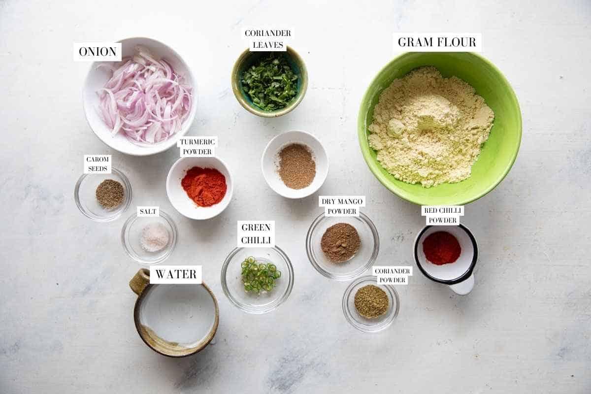 Ingredients to make pakoda of kadhi pakoda with text overlay
