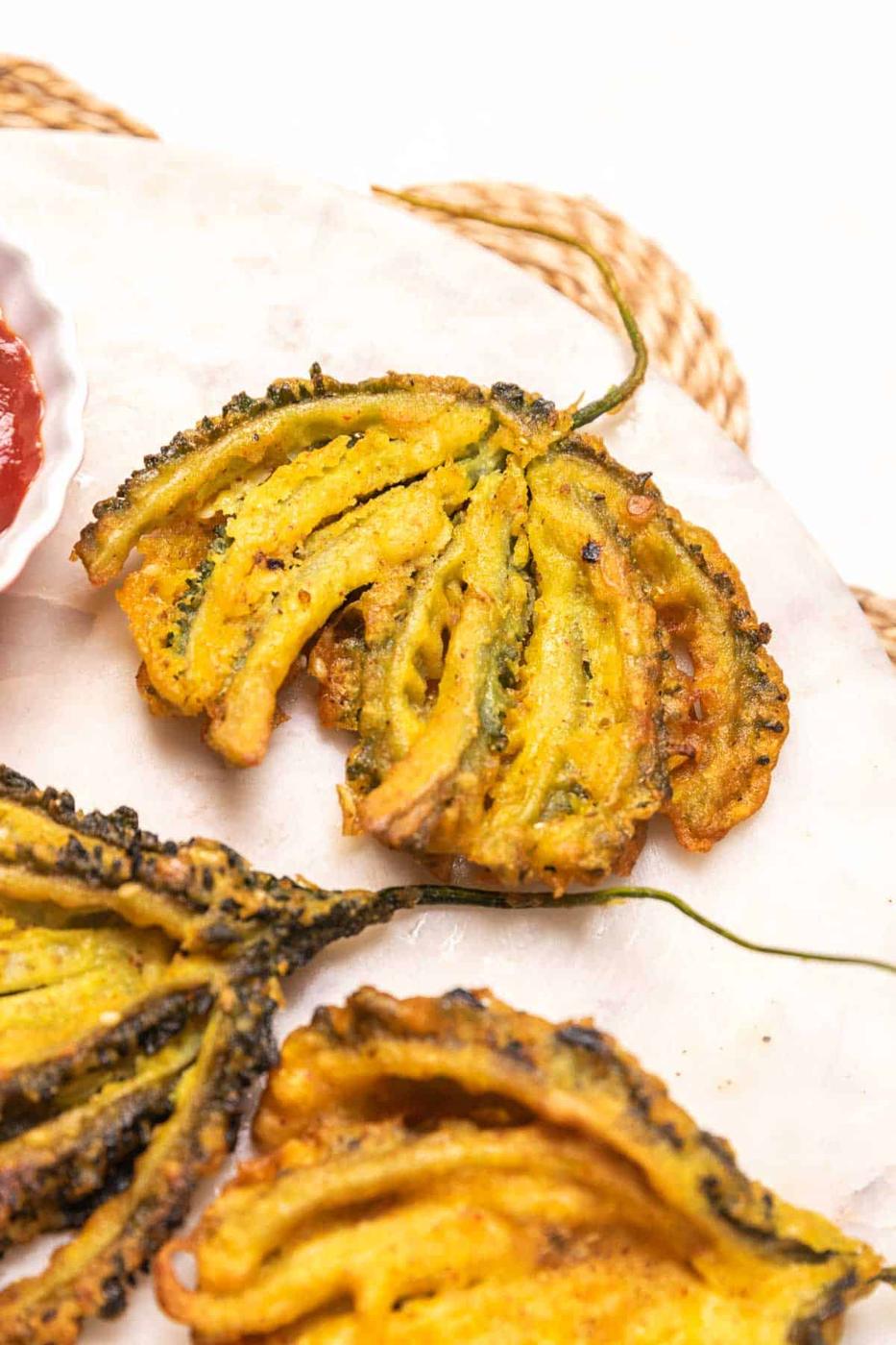 close up of karela pakoda to show it's crispy texture