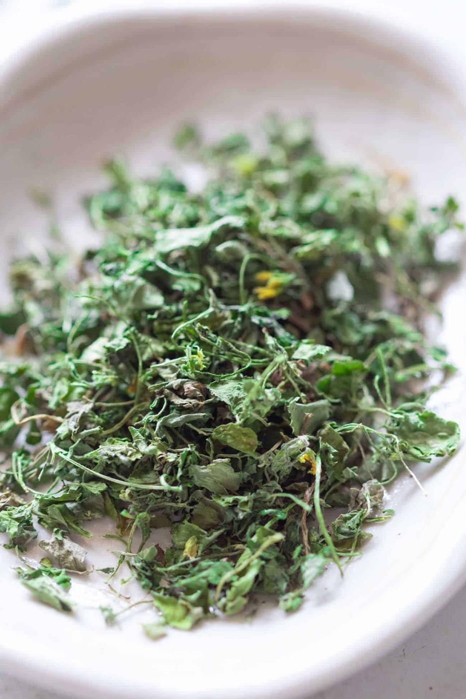 close up shot of kasuri methi on a white plate