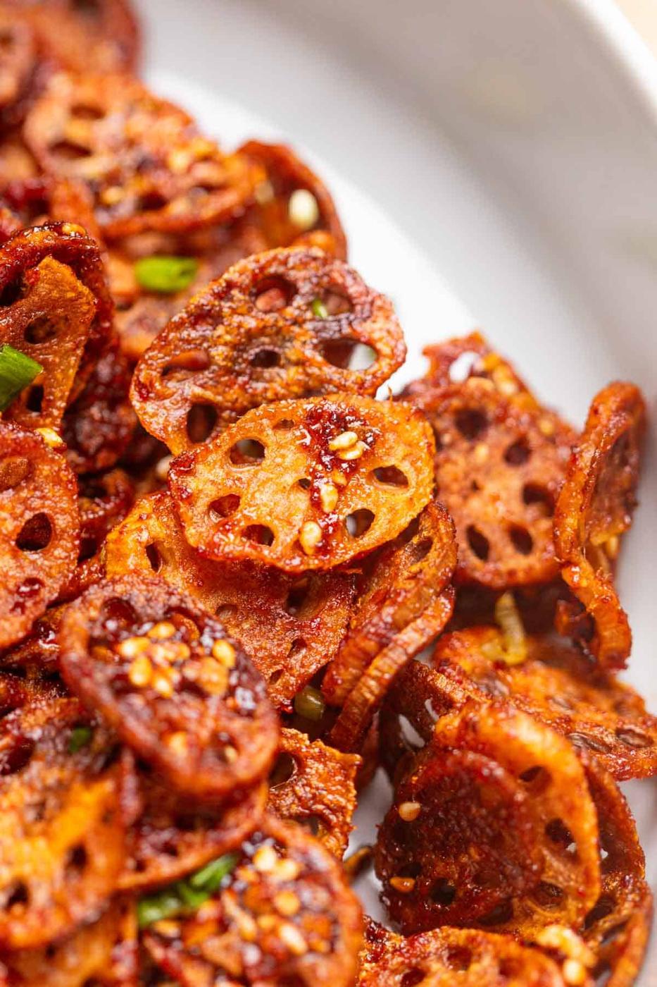 close up image of Korean crispy lotus stem to show it's thin and crispy texture