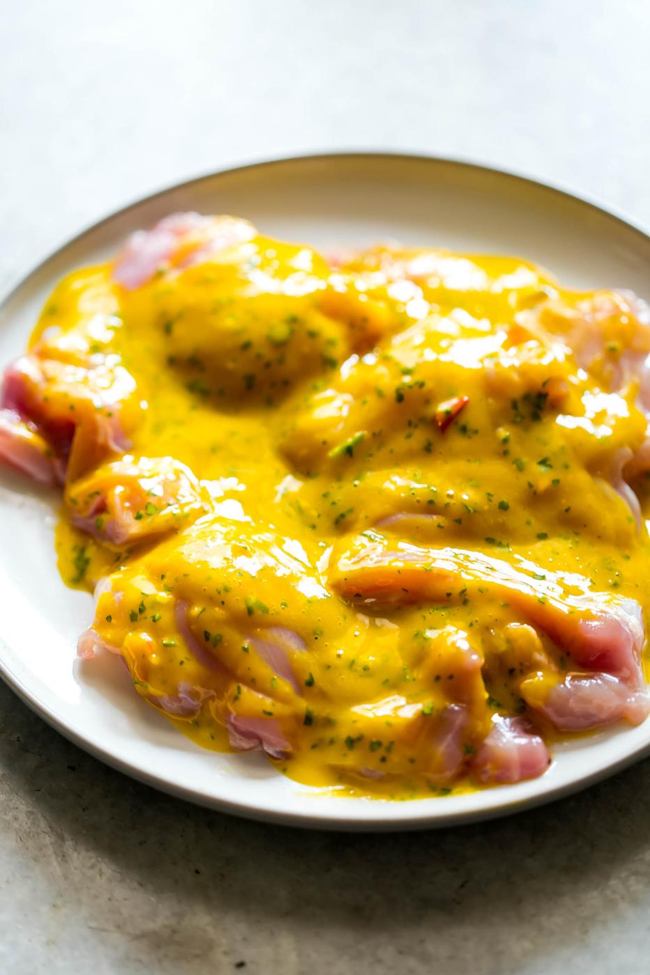 Mango Cilantro Salad Dressing is a fresh, tropical, creamy dressing that's super healthy, easily made in a blender and is gluten free. You'll want to pour it on everything!