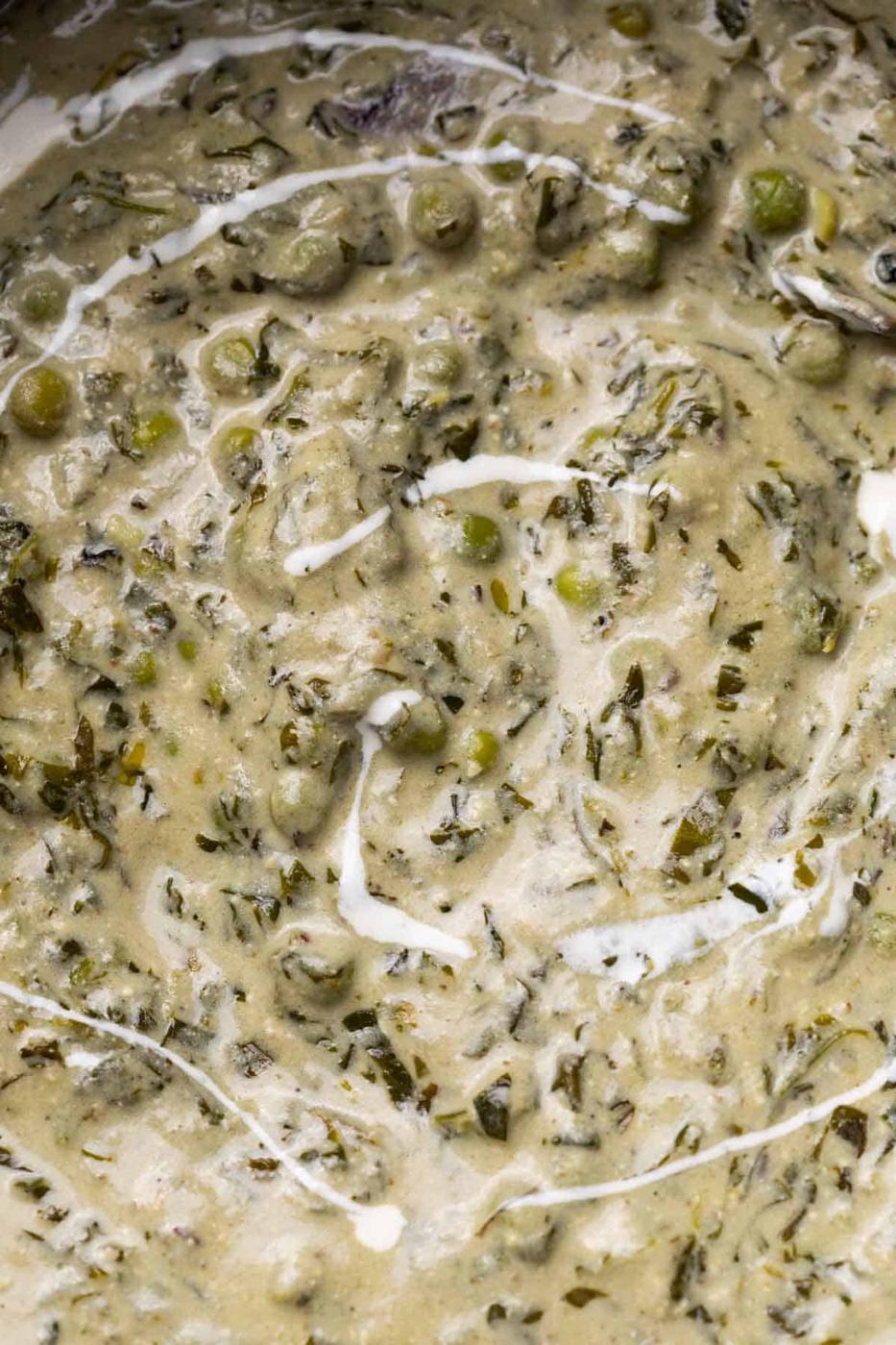 Close up of the texture and creaminess of methi matar malai