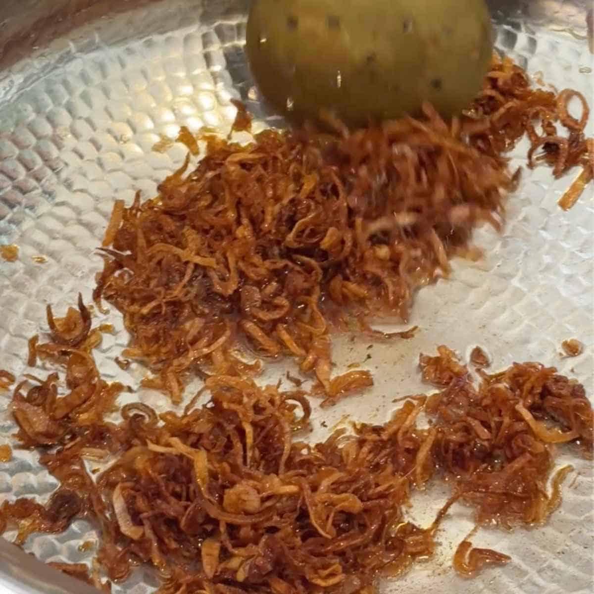 mushroom biryani step 3 - frying onions