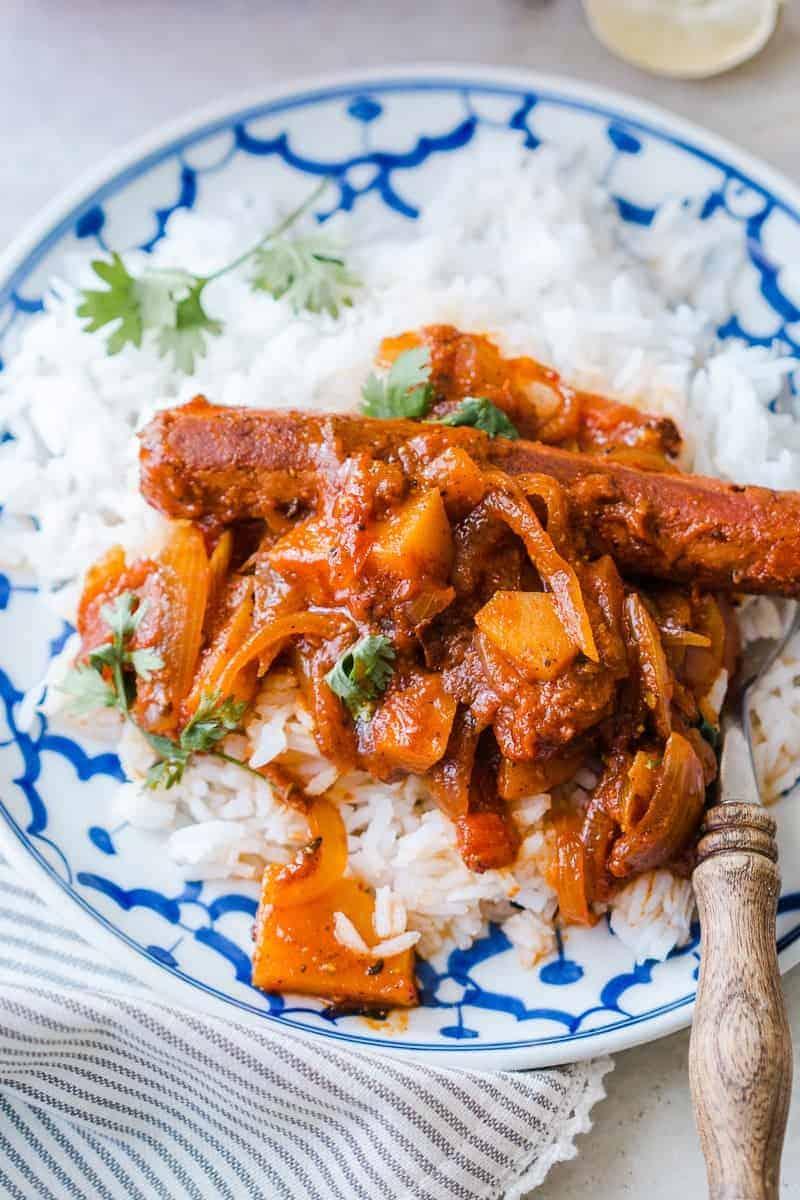 Insanely delicious and super easy recipe for curried sausages and potatoes which needs only one pot and is ready in under 30 minutes!