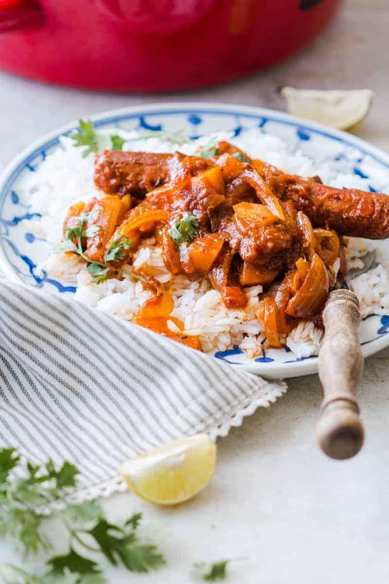 Insanely delicious and super easy recipe for curried sausages and potatoes which needs only one pot and is ready in under 30 minutes!