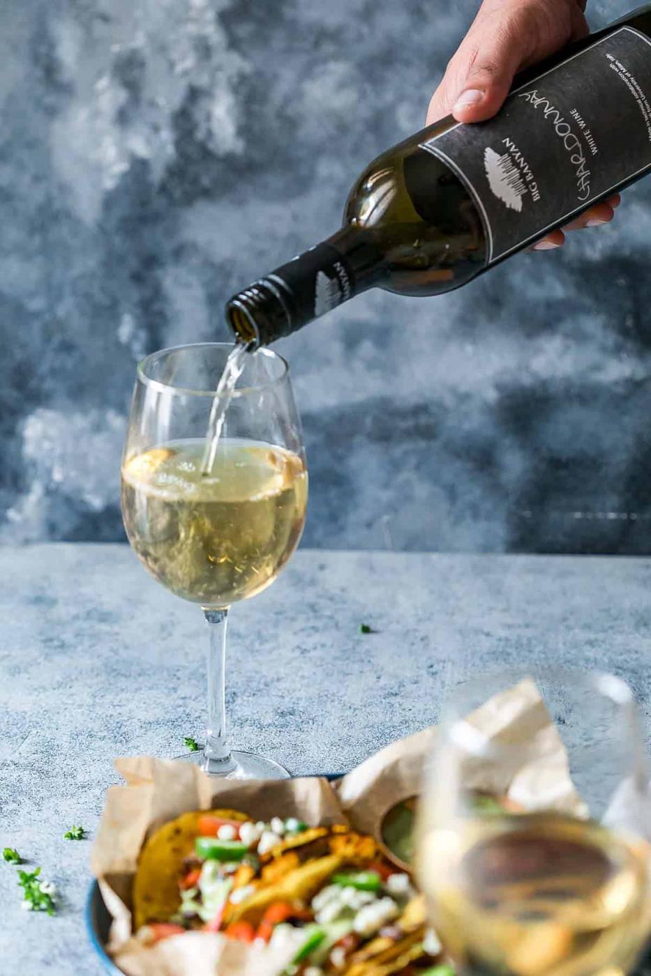 Vegetarian Portobello Mushroom Fajita Tacos paired with a glass of Big Banyan's Chardonnay white wine.