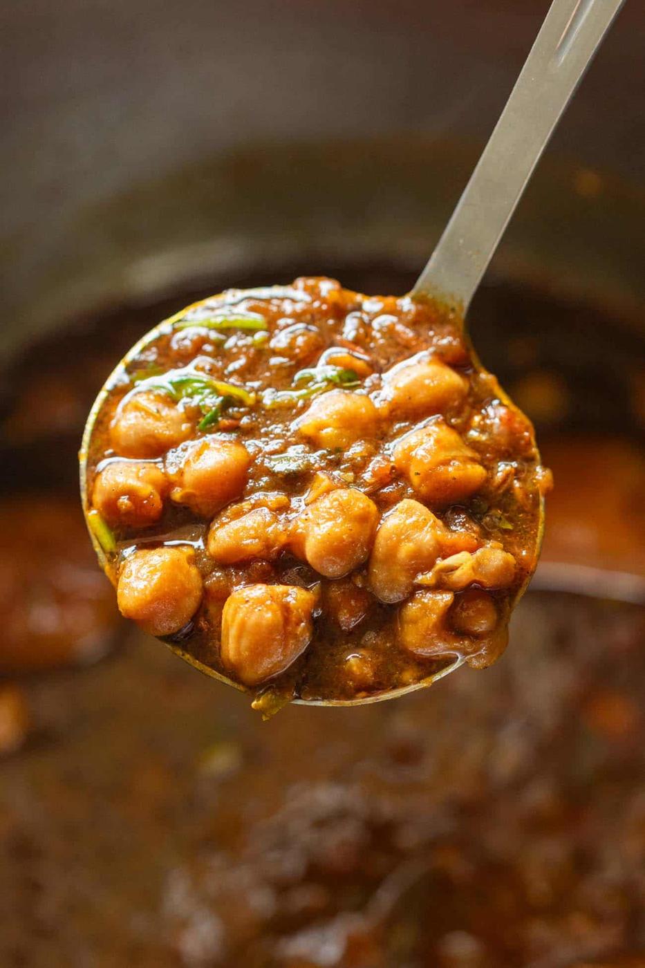 image of a ladle full of chana masala