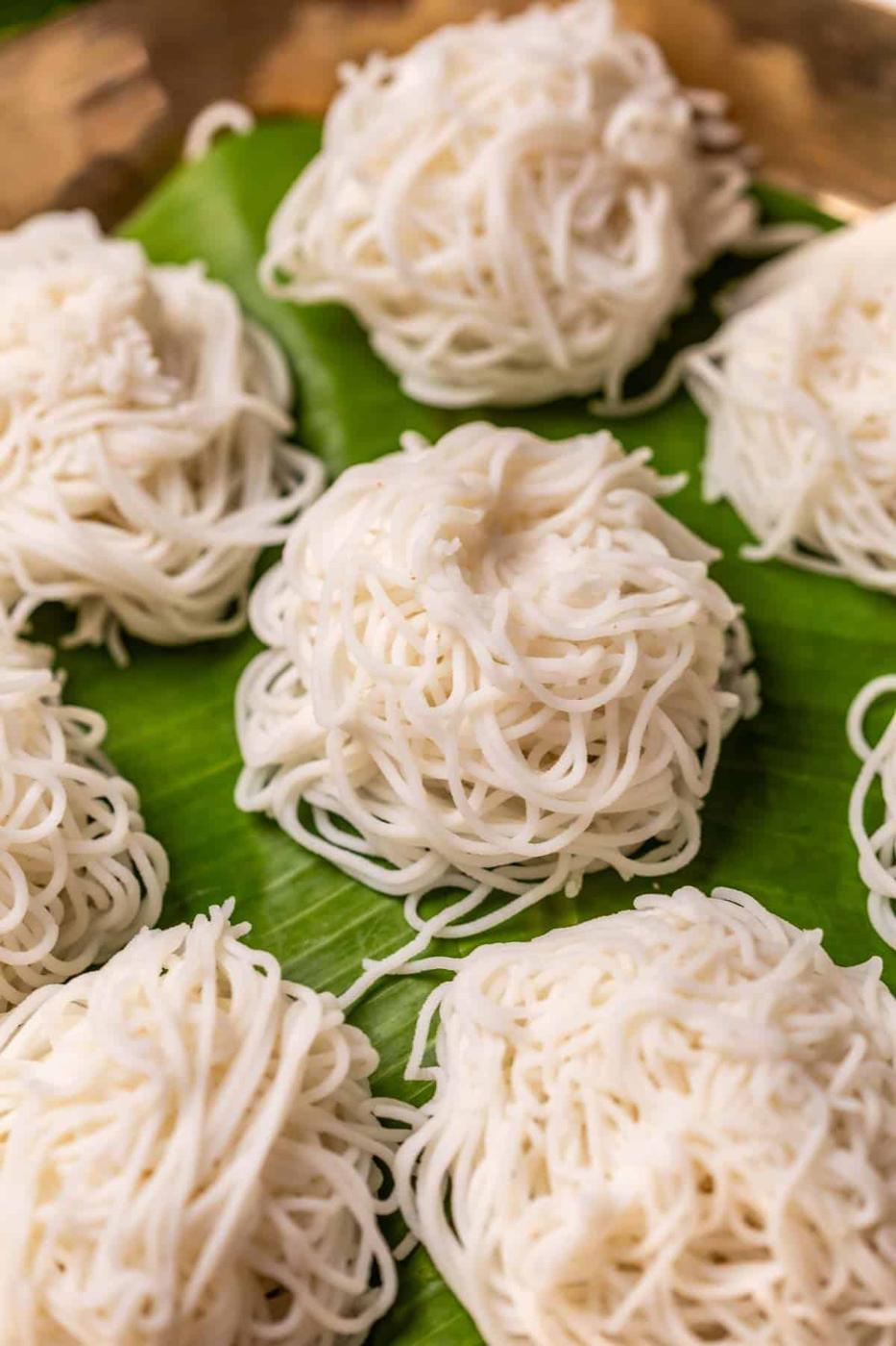 Rice idiyappams served on banana leaf in a plate