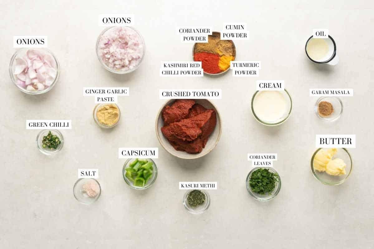 Picture of all the ingredients required for slow cooker chicken tikka masala with text to identify them