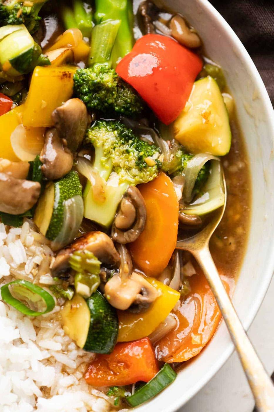 Closeup of Asian Veg Stir Fry served in a bowl over white rice