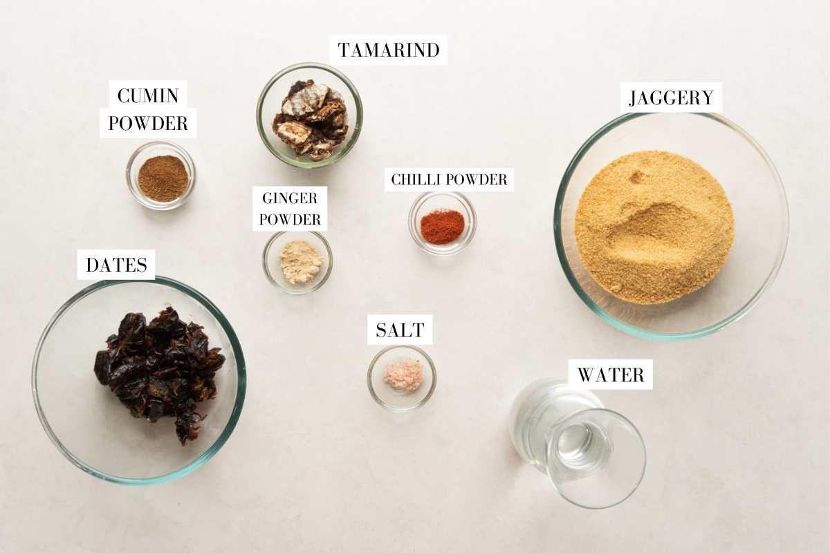 Picture of all the ingredients for tamarind chutney with text overlay
