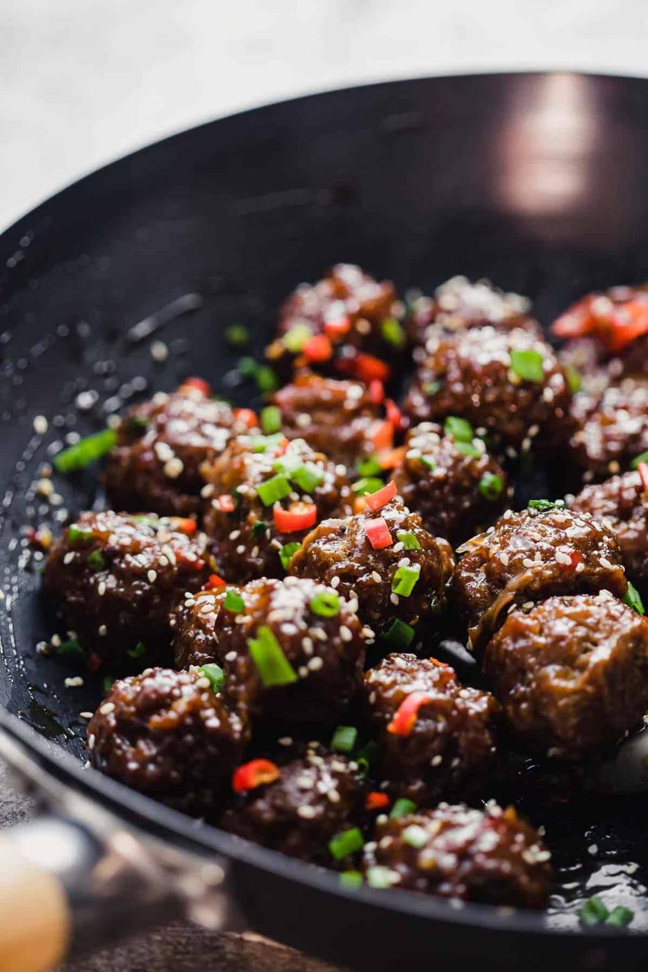 Sticky Thai Meatballs tossed in a wok