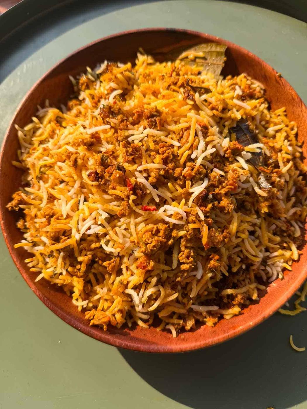 Veg soya keema biryani served in a brown bowl