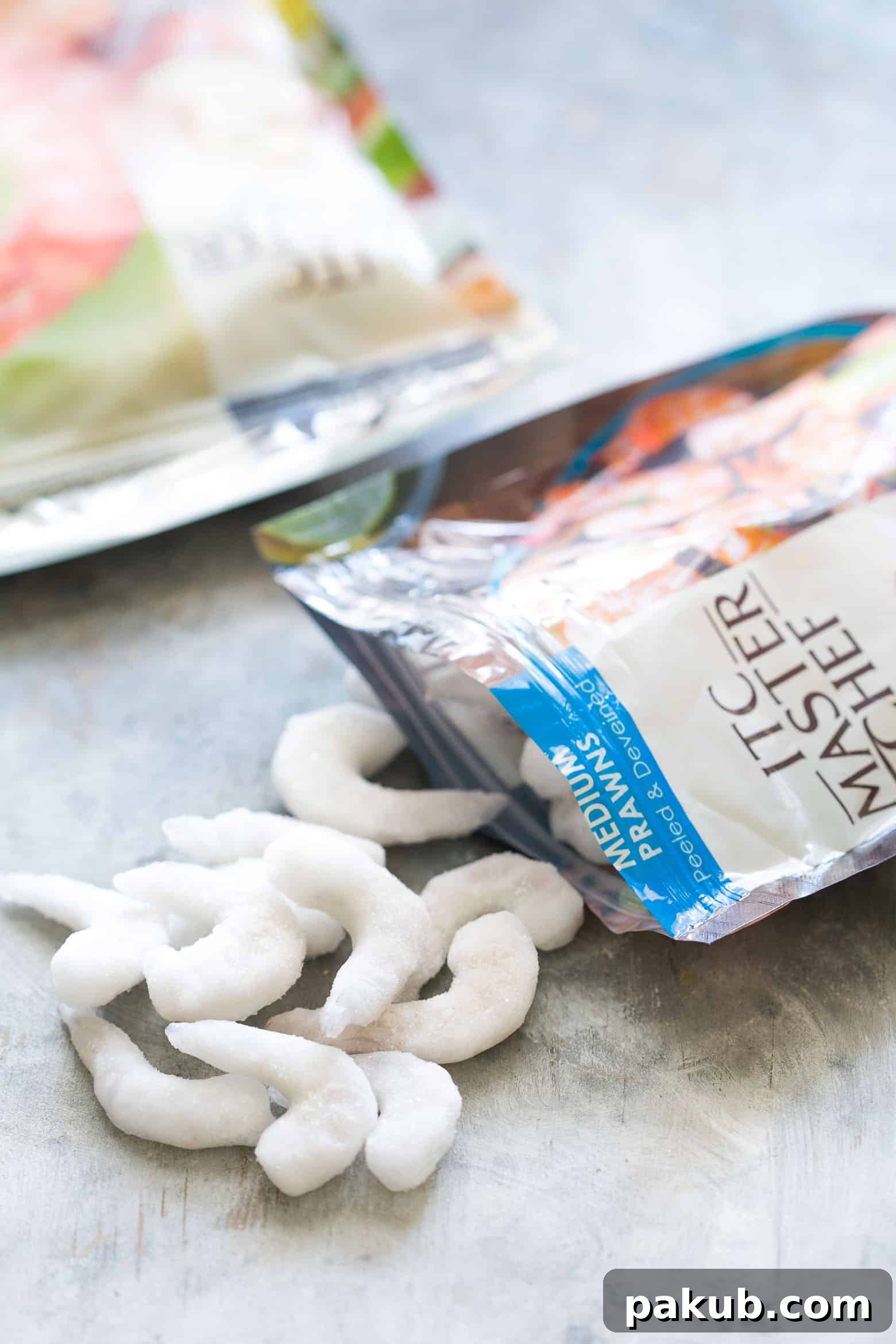 Keep Your Prawns Perfect: Safe Defrosting Methods 3 A close-up of perfectly thawed prawns, showcasing their pristine condition, ready for cooking. The image emphasizes the importance of safe defrosting for maintaining the integrity and appeal of seafood.
