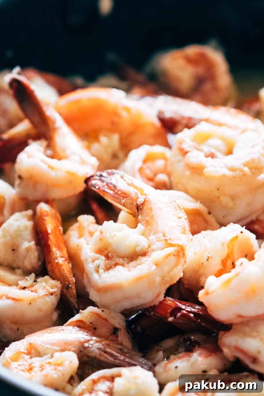 Shrimp Spaghetti Aglio Olio plated beautifully, showcasing the golden-brown shrimp, shiny spaghetti, and specks of green parsley, ready to be enjoyed as a quick and flavorful Italian dinner.
