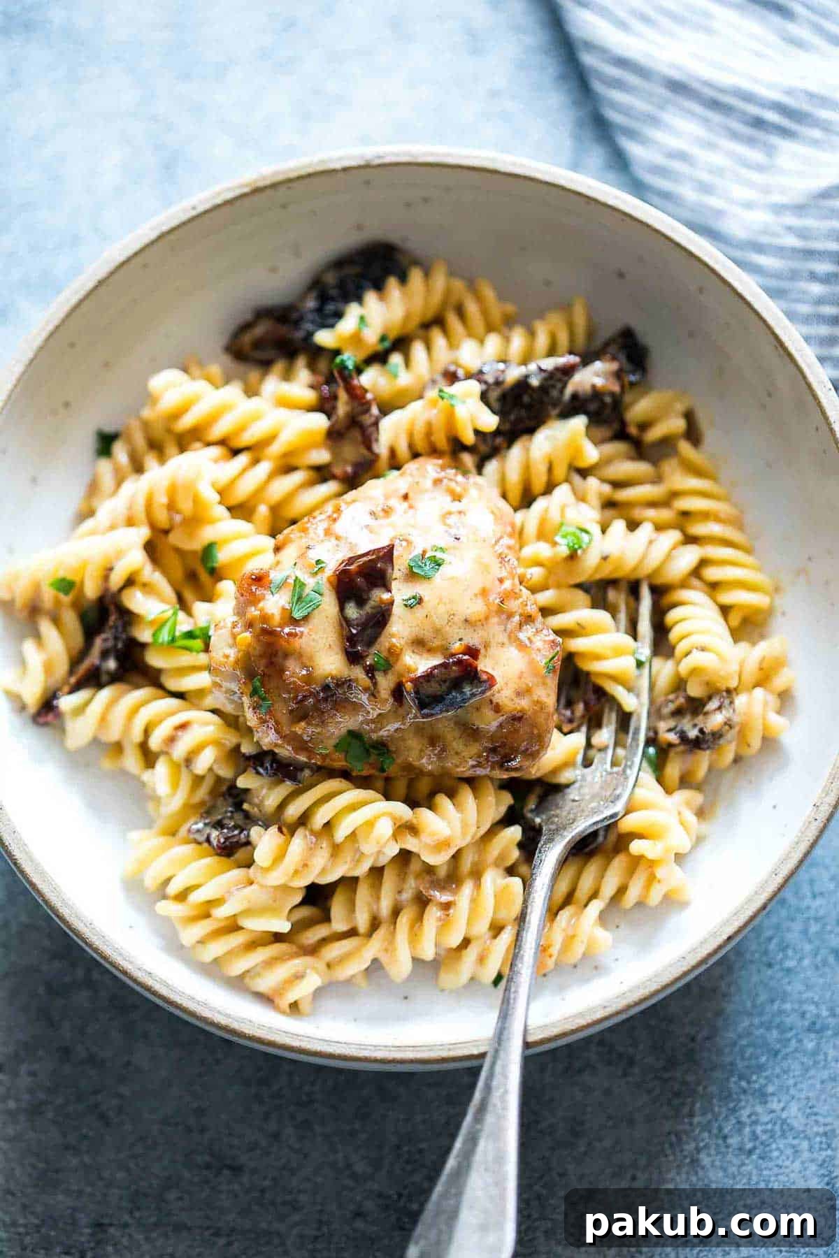 Creamy Tuscan Chicken and Sun-dried Tomato Pasta 4 Creamy Sun-dried Tomato Chicken served with Pasta in a bowl, garnished.