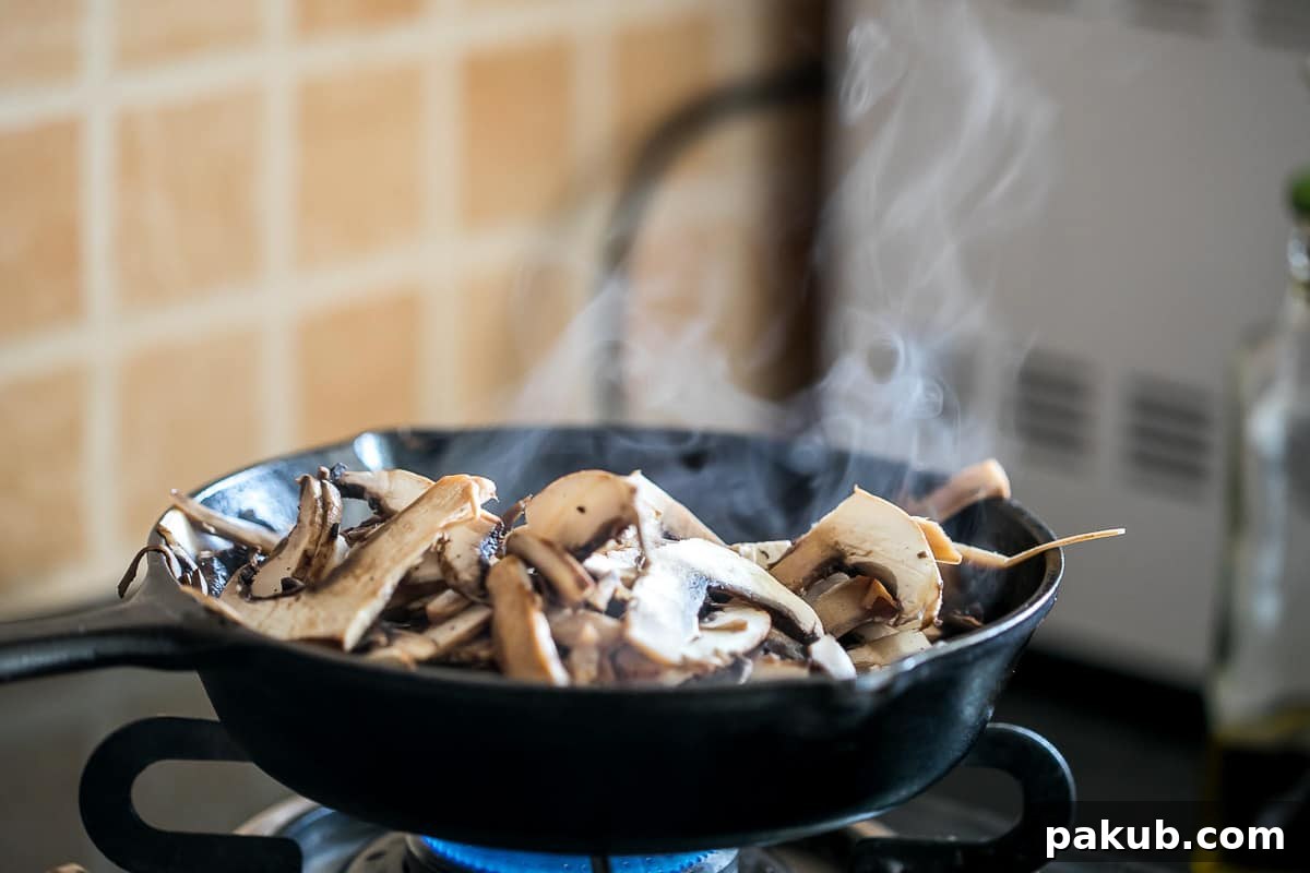 Portobello mushrooms being prepared for fajita tacos.