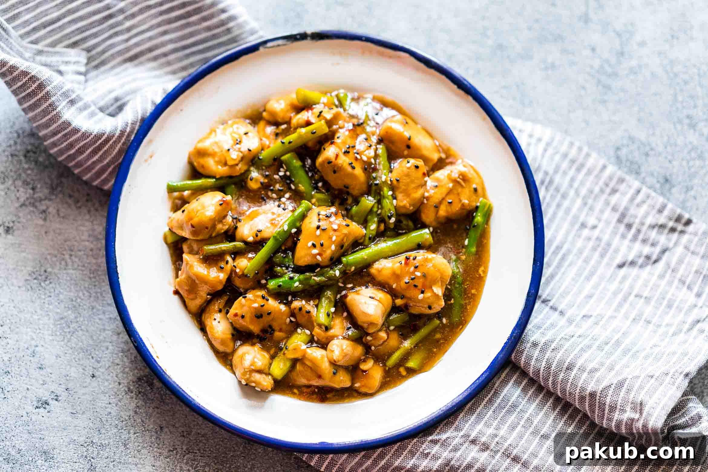 Easy lemon ginger chicken asparagus stir fry, a quick and healthy 30-minute Asian meal that is low carb and can be gluten-free, perfect for a light yet satisfying dinner.