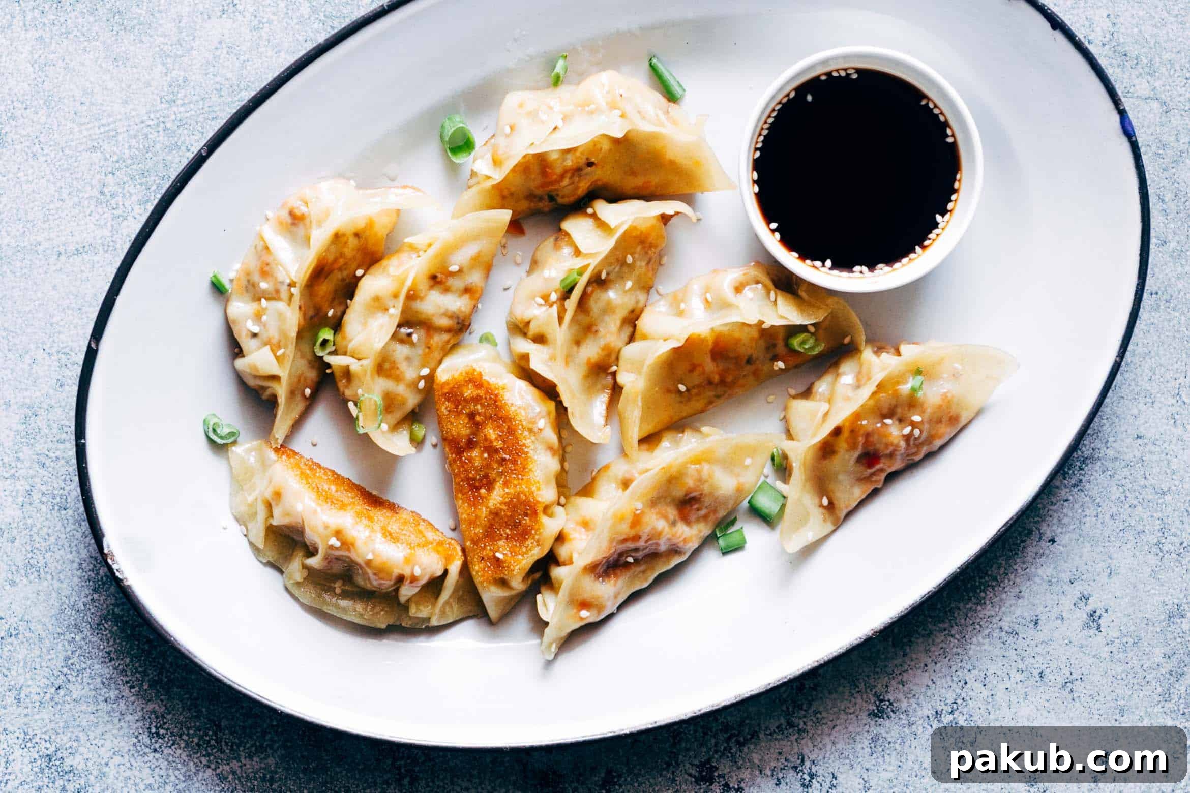 Delicious vegetarian gyoza potstickers stuffed with a flavorful mixture of carrots, shiitake mushrooms, and paneer, complete with easy step-by-step instructions for making them at home.